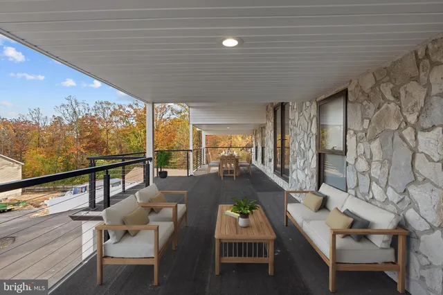a living room with fireplace furniture and a window