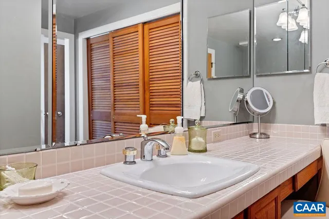 a bedroom with a large window and a bed