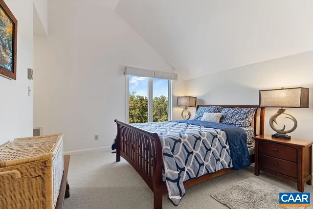 a view of a house with a yard and potted plants