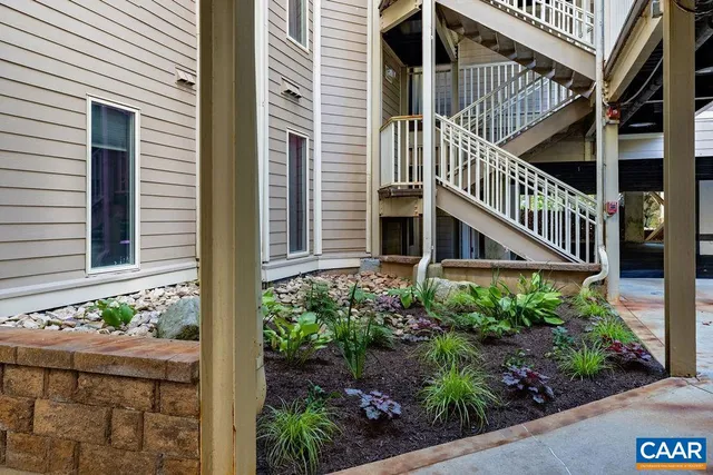 front view of a house with a tree