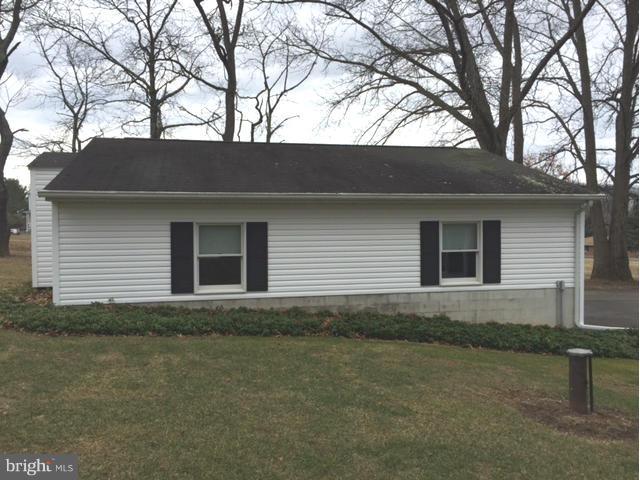 5095 Grave Run Road Manchester, MD 21102 - Photo 16 of 17 a side view of house with yard