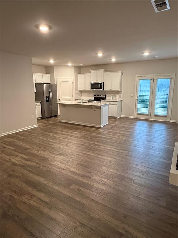 30 Rustin Ridge Dahlonega, GA 30533 - Photo 5 of 12 a big room with wooden floors and kitchen view