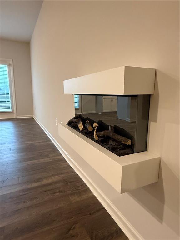 30 Rustin Ridge Dahlonega, GA 30533 - Photo 6 of 12 a kitchen with wooden floor and stove