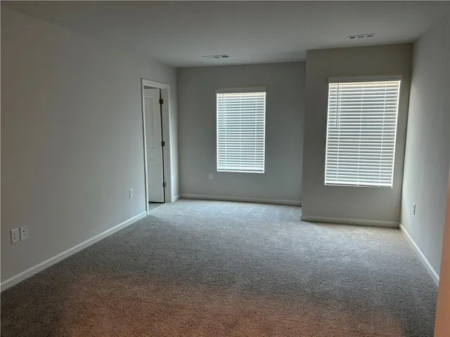 a view of a room that has a window in it