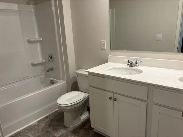 a bathroom with a sink a toilet and a bathtub