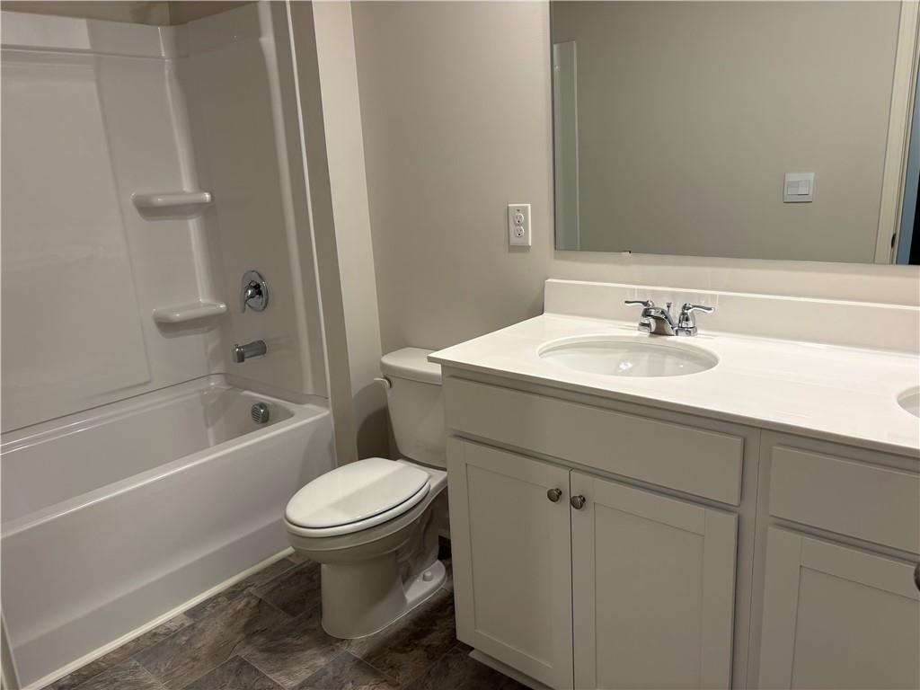 30 Rustin Ridge Dahlonega, GA 30533 - Photo 10 of 12 a bathroom with a sink a toilet and a bathtub