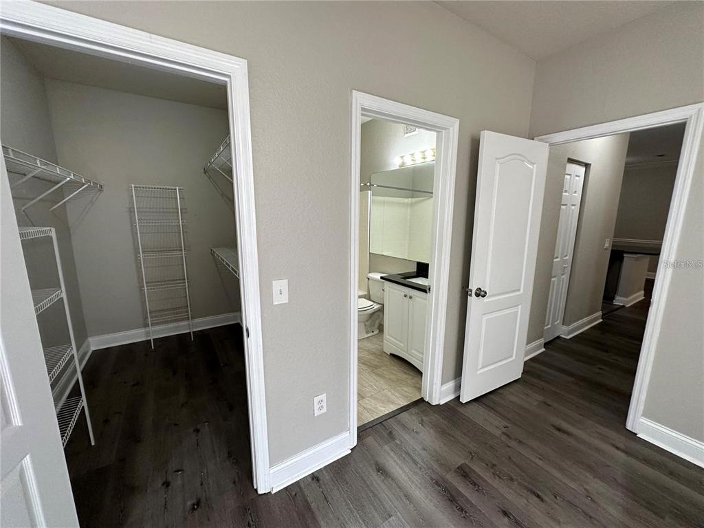 3307 South Kirkman Road, Unit 129 Orlando, FL 32811 - Photo 17 of 24 a view of hallway with wooden floor