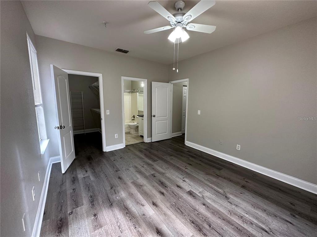 3307 South Kirkman Road, Unit 129 Orlando, FL 32811 - Photo 18 of 24 a view of a livingroom with wooden floor