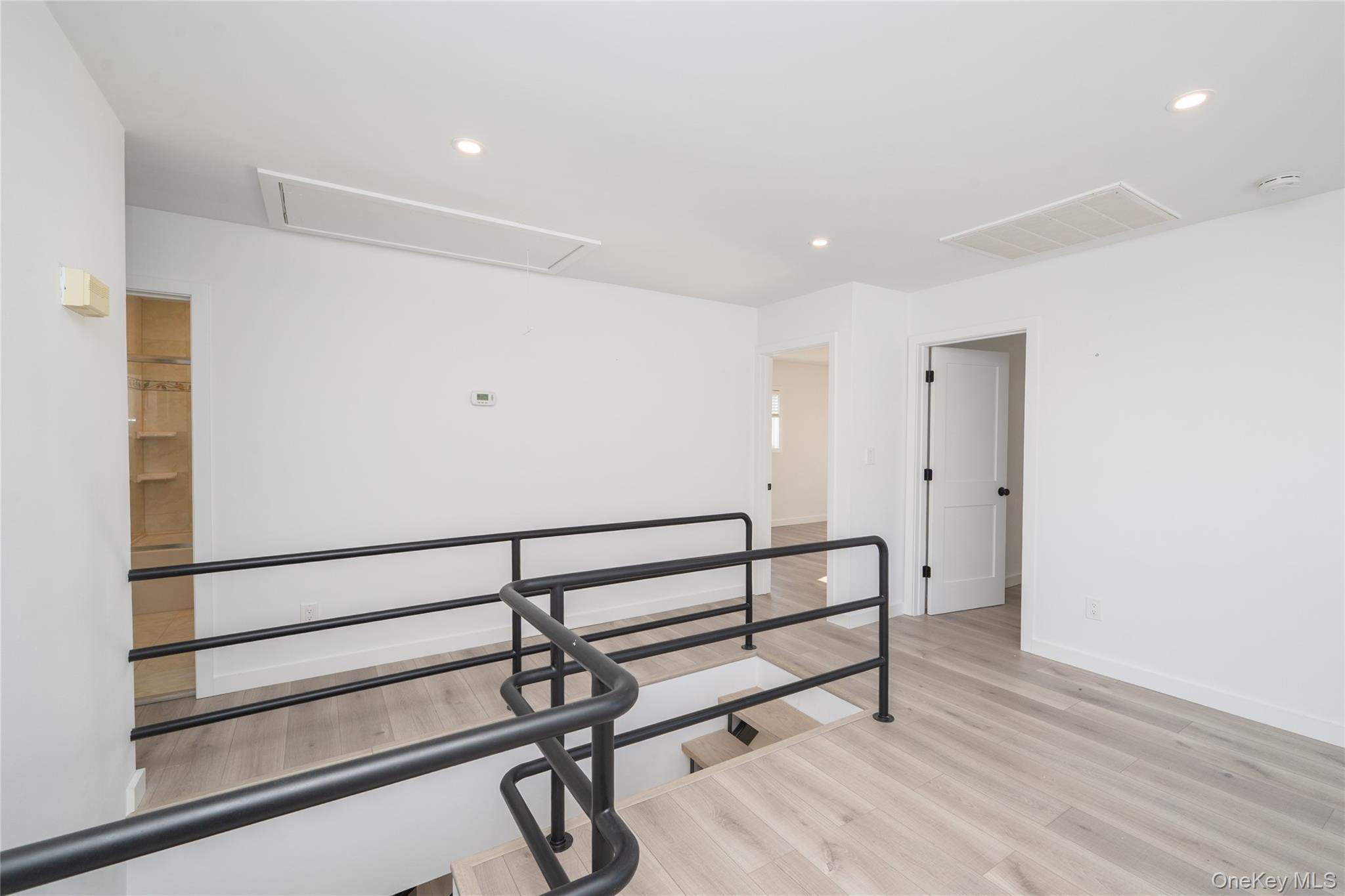 15 Roneck Court Shirley, NY 11967 - Photo 26 of 44 a view of a room with wooden floor