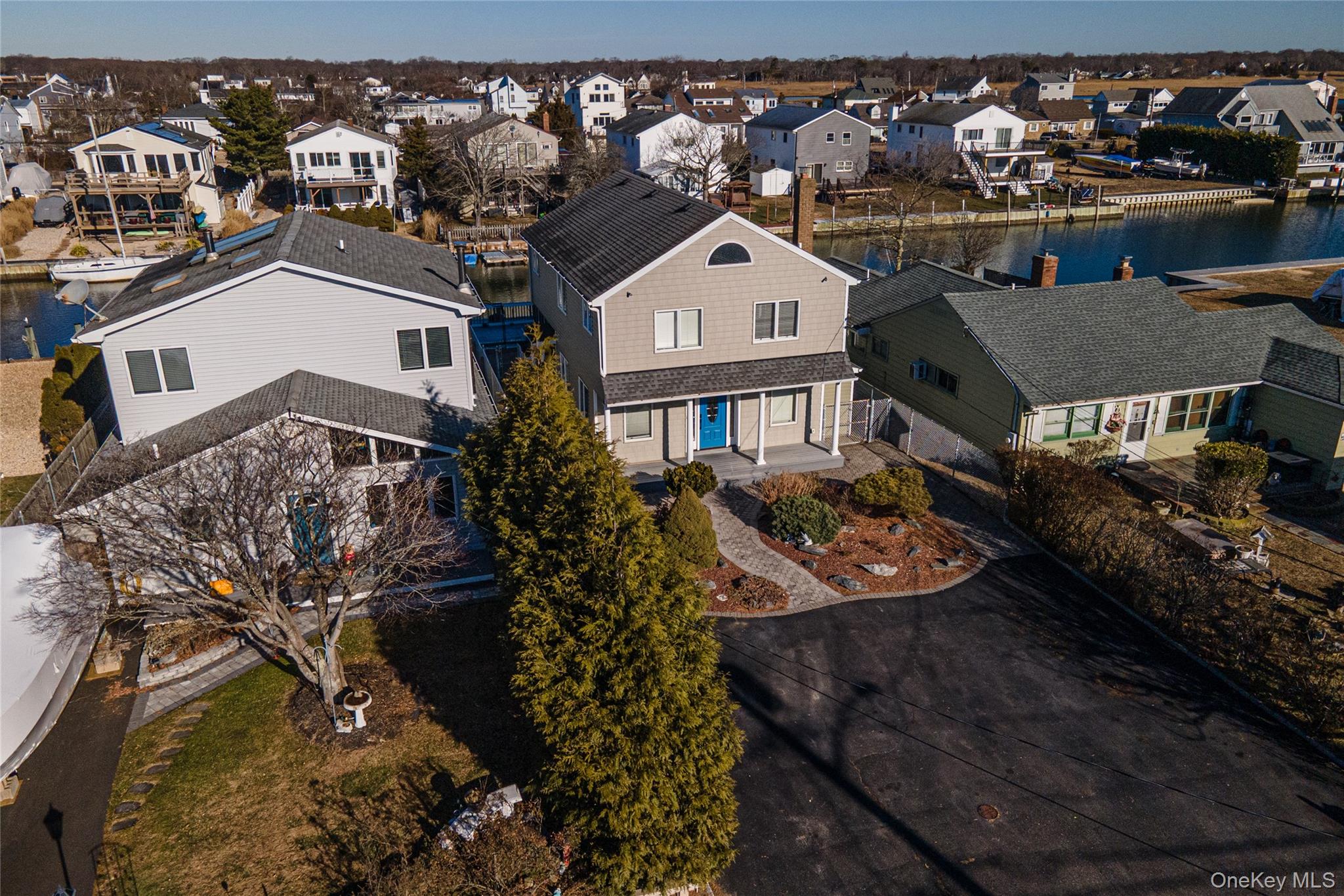 15 Roneck Court Shirley, NY 11967 - Photo 3 of 44 a view of a house with a yard