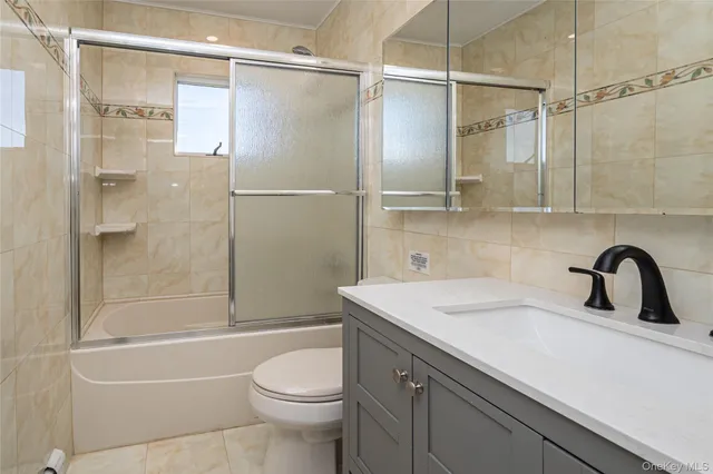 a bathroom with a sink a toilet and a bathtub