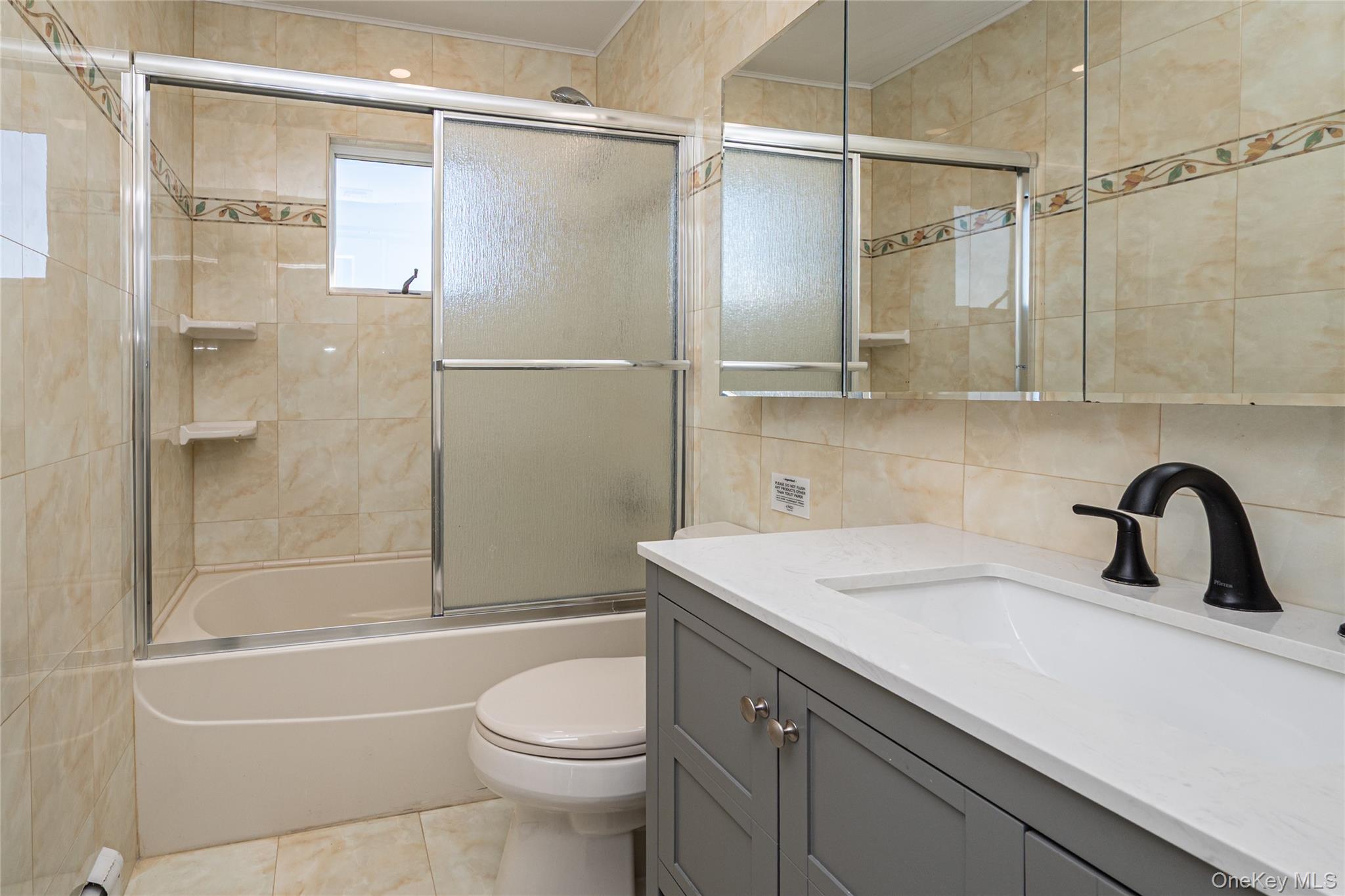 15 Roneck Court Shirley, NY 11967 - Photo 30 of 44 a bathroom with a sink toilet and shower