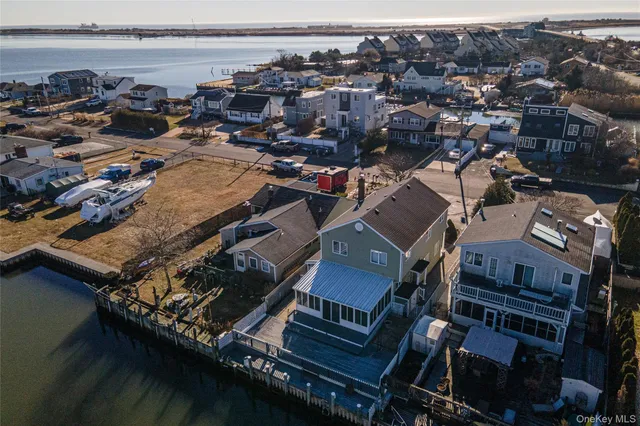 an aerial view of a house with a lake view