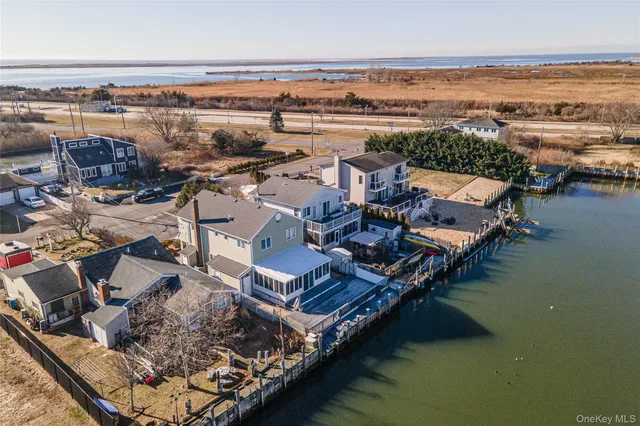 an aerial view of a house with lake view