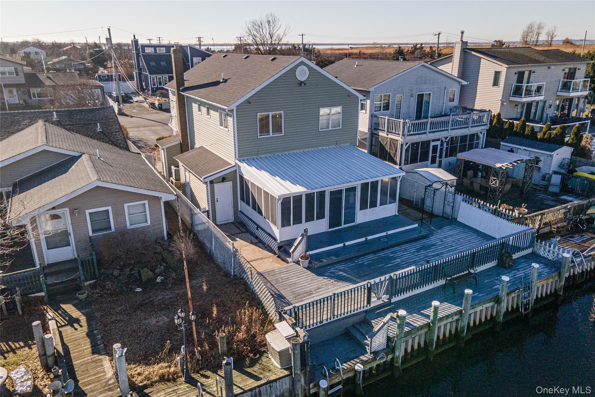 15 Roneck Court Shirley, NY 11967 - Photo 8 of 44 a front view of a house with balcony