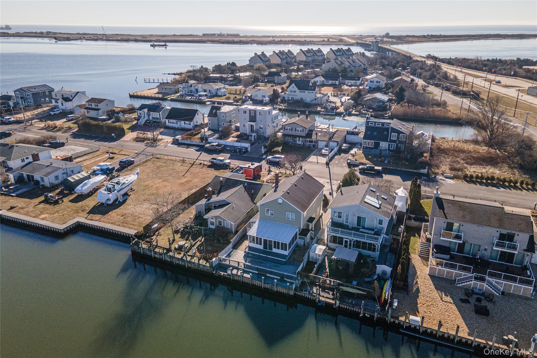 15 Roneck Court Shirley, NY 11967 - Photo 10 of 44 an aerial view of residential houses with outdoor space