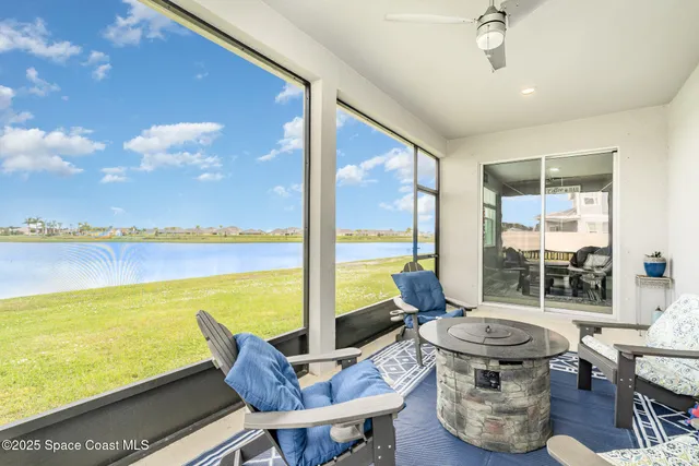 a view of swimming pool with outdoor seating
