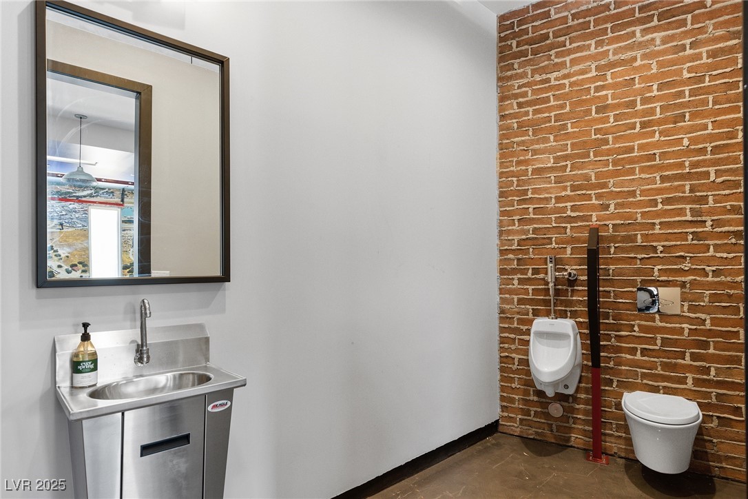 2240 Sky Pointe Ridge Drive Henderson, NV 89052 - Photo 65 of 66 Half bath with urinal in the garage