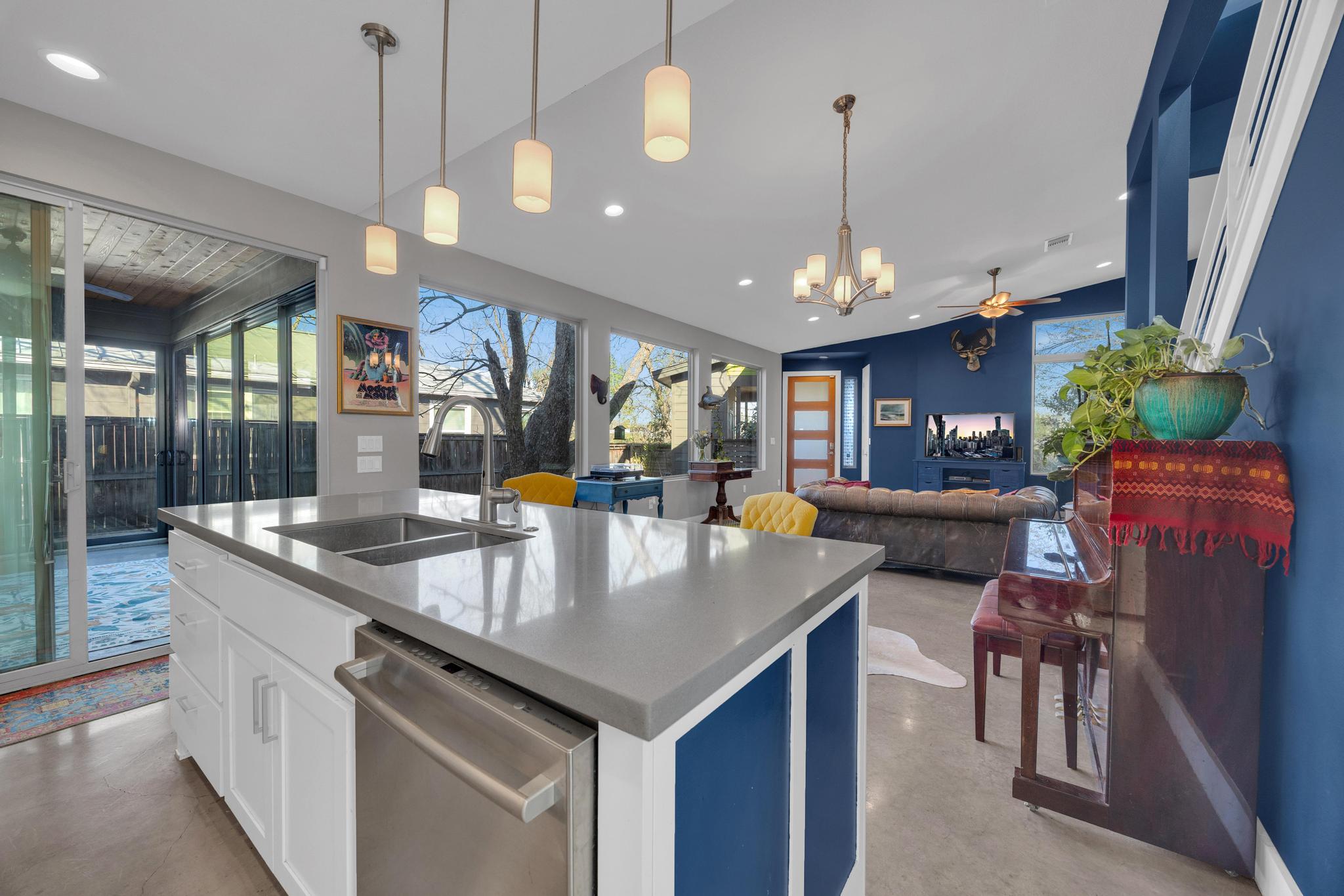 4404 Clarkson Avenue Austin, TX 78751 - Photo 12 of 35 a living room with stainless steel appliances granite countertop furniture a kitchen island a dining table and chairs