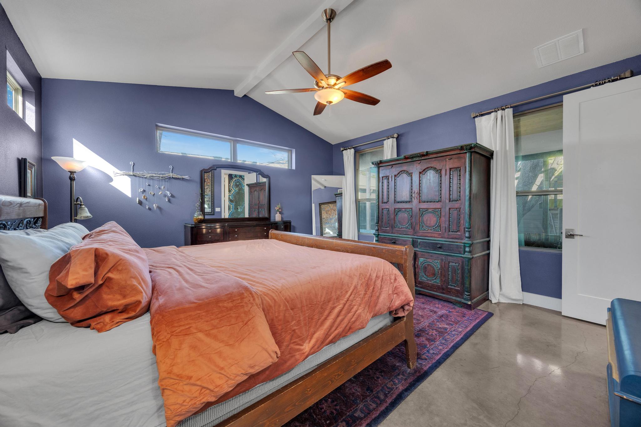 4404 Clarkson Avenue Austin, TX 78751 - Photo 14 of 35 a bed room with a bed and a mirror