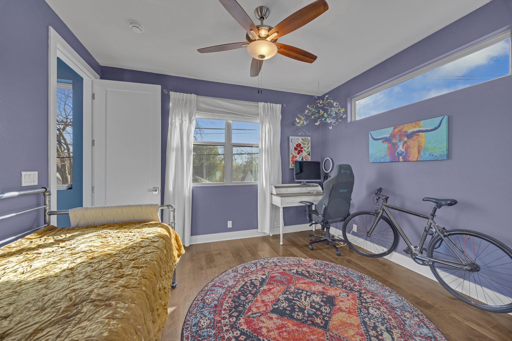 4404 Clarkson Avenue Austin, TX 78751 - Photo 19 of 35 a bedroom with bed and a chandelier