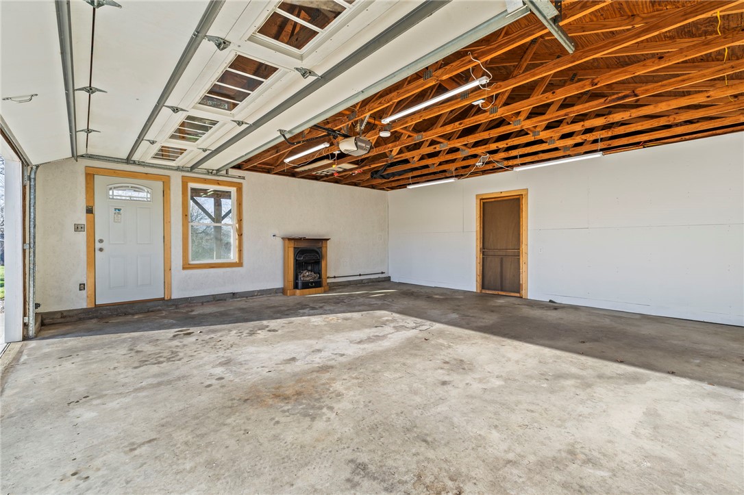 10797 Gratis Jacksonburg Road Somerville, OH 45064 - Photo 23 of 27 This spacious garage offers ample room for vehicles and projects.