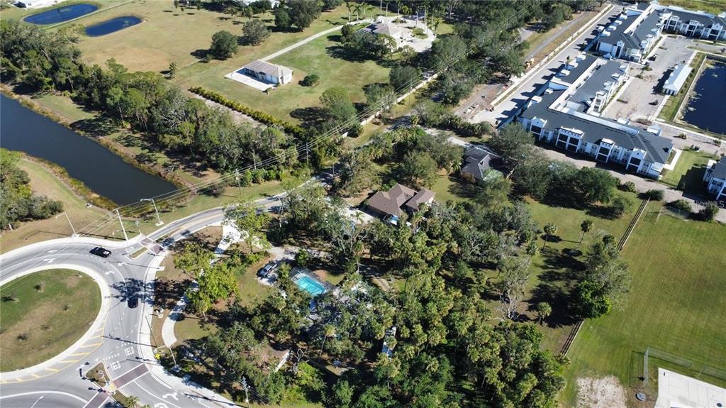 6500 Richardson Road Sarasota, FL 34240 - Photo 3 of 5 an aerial view of a house with a yard and garden