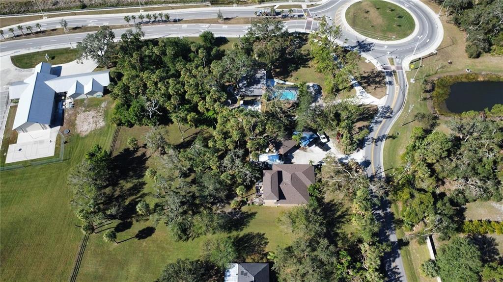 6500 Richardson Road Sarasota, FL 34240 - Photo 4 of 5 an aerial view of residential house with outdoor space and swimming pool