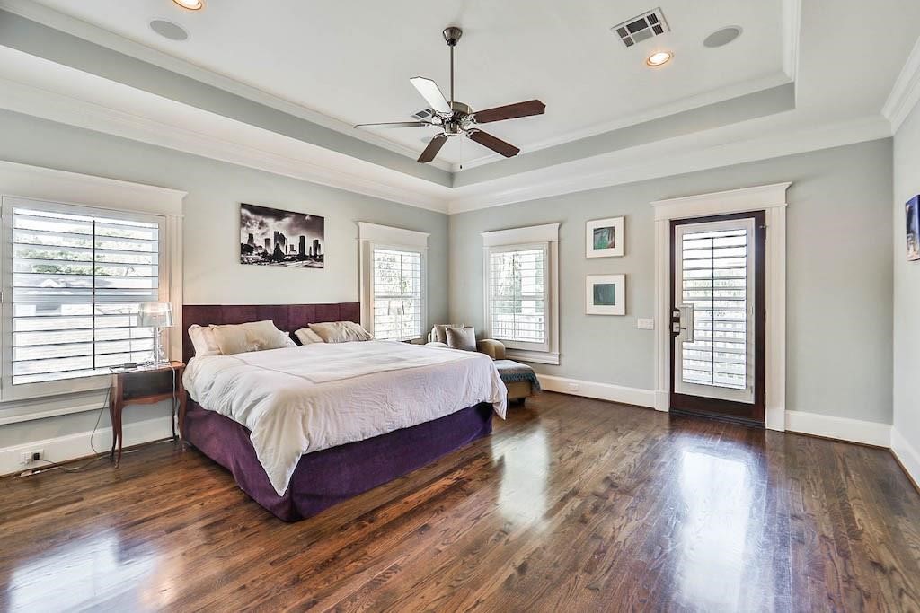 1436 Harvard Street Houston, TX 77008 - Photo 13 of 18 a spacious bedroom with a bed and a window