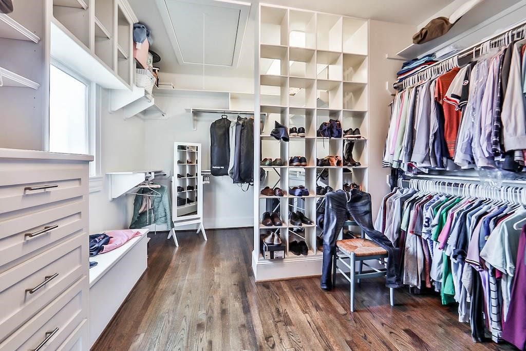 1436 Harvard Street Houston, TX 77008 - Photo 15 of 18 a view of walk in closet with clothes and shoes