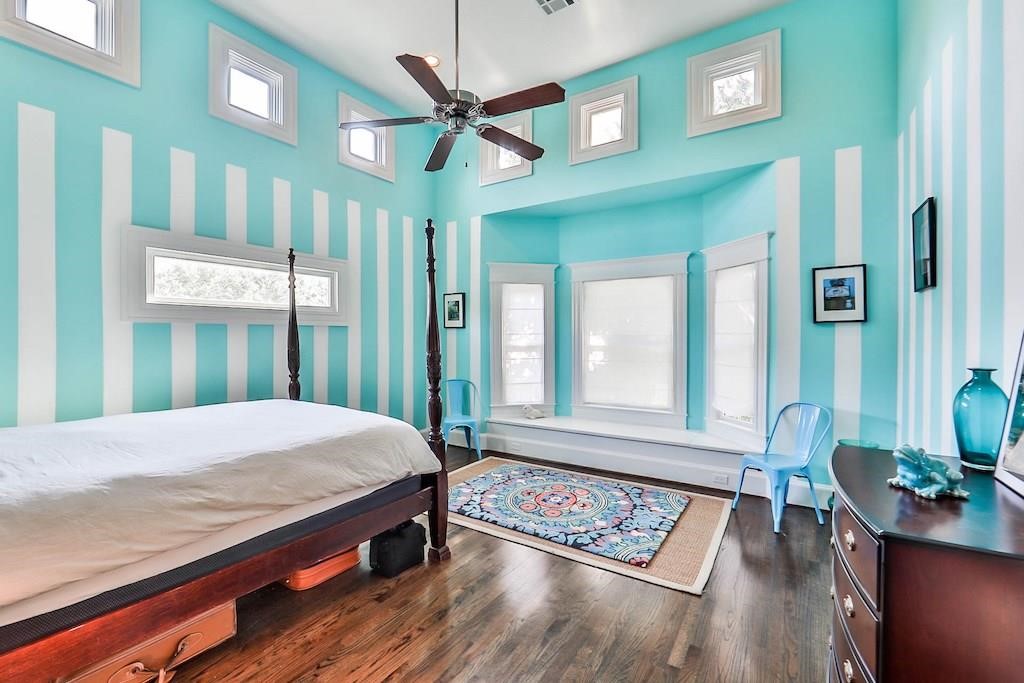 1436 Harvard Street Houston, TX 77008 - Photo 17 of 18 a bed sitting in a bedroom next to a window