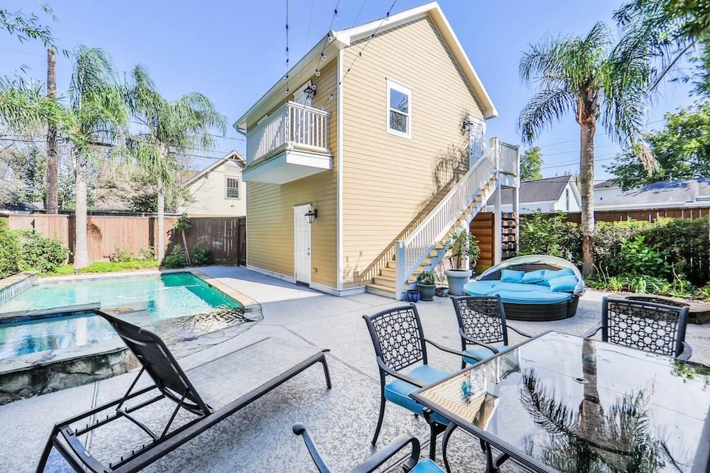 1436 Harvard Street Houston, TX 77008 - Photo 2 of 18 a view of a patio with couches table and chairs and potted plants