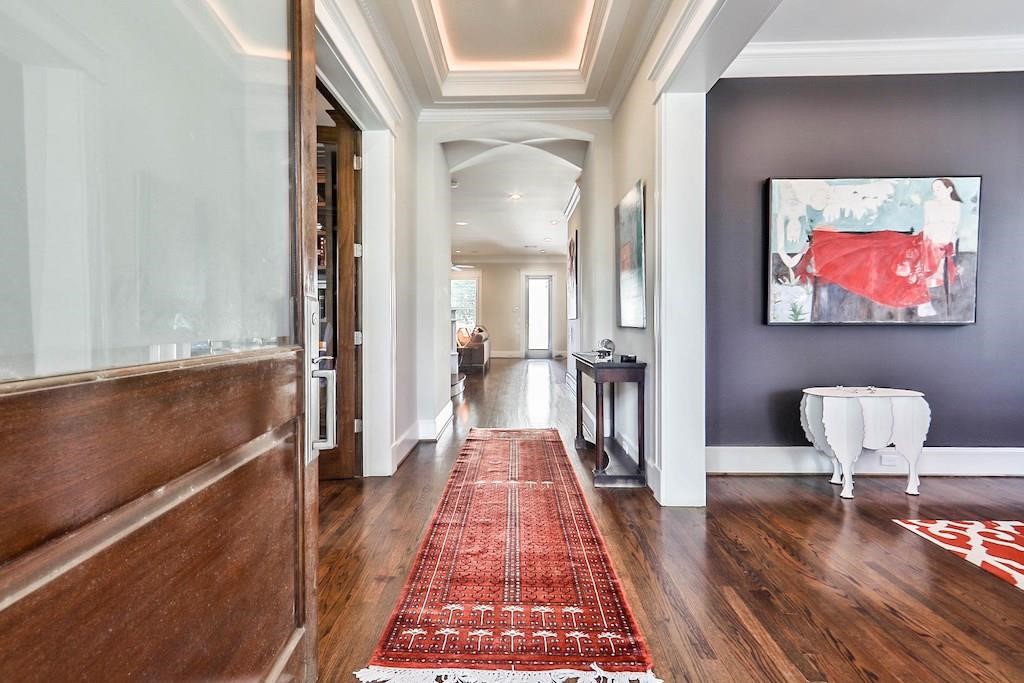 1436 Harvard Street Houston, TX 77008 - Photo 5 of 18 a view of a hallway with furniture and wooden floor