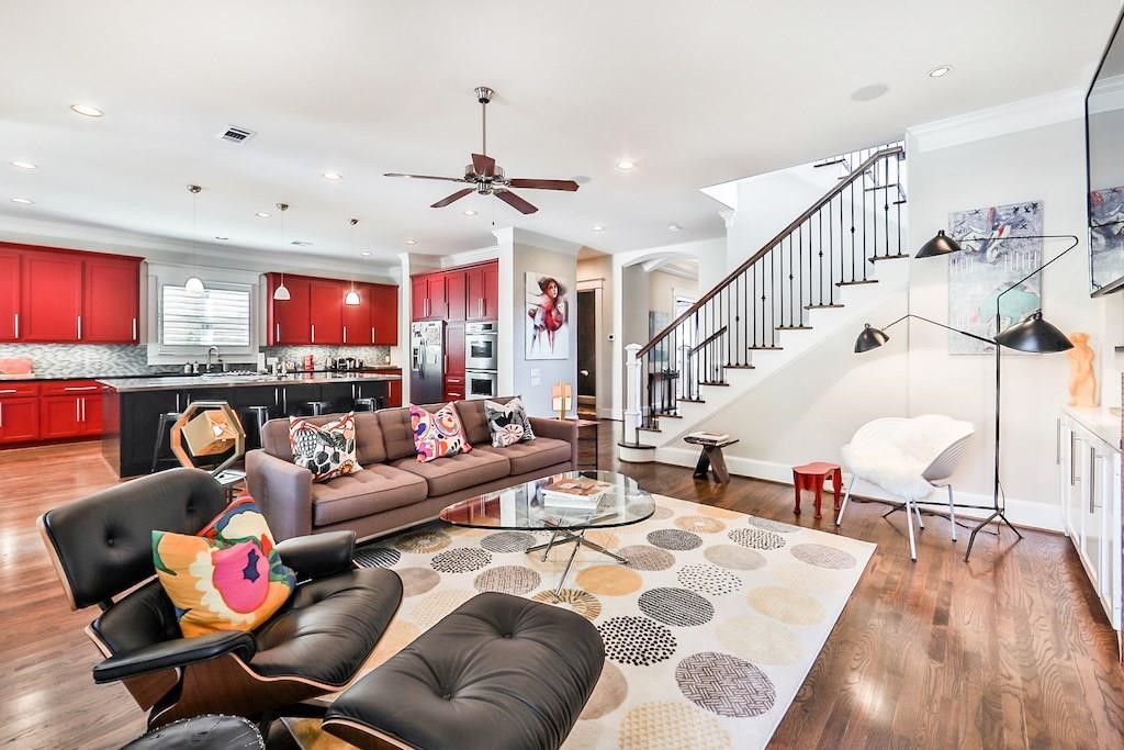 1436 Harvard Street Houston, TX 77008 - Photo 7 of 18 a living room with fireplace furniture and a wooden floor