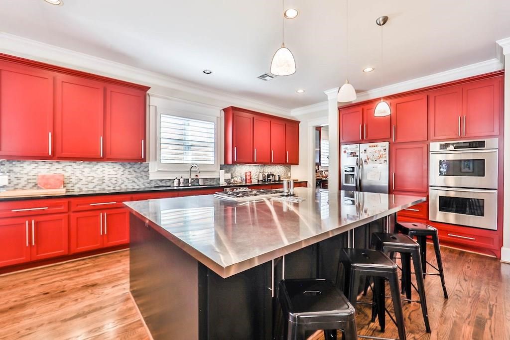 1436 Harvard Street Houston, TX 77008 - Photo 8 of 18 a kitchen with stainless steel appliances granite countertop a sink and cabinets