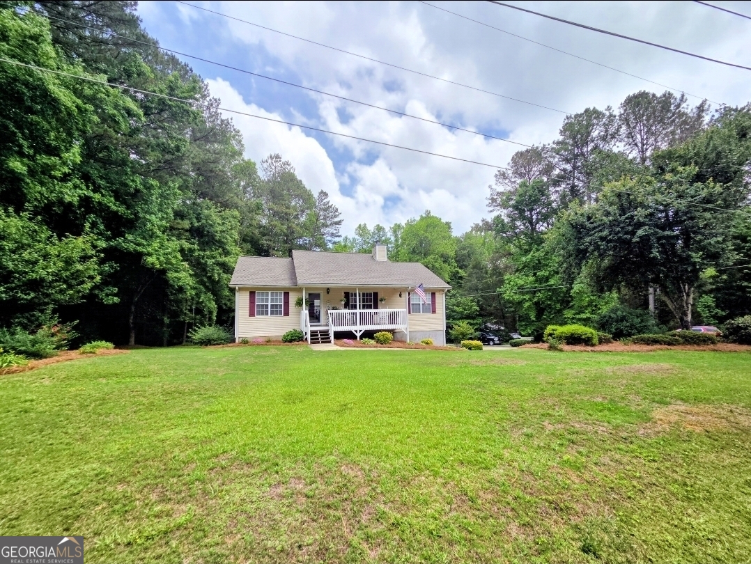 21 Baskin Heights Path Temple, GA 30179 - Photo 3 of 44 a view of a house with a big yard plants and large trees