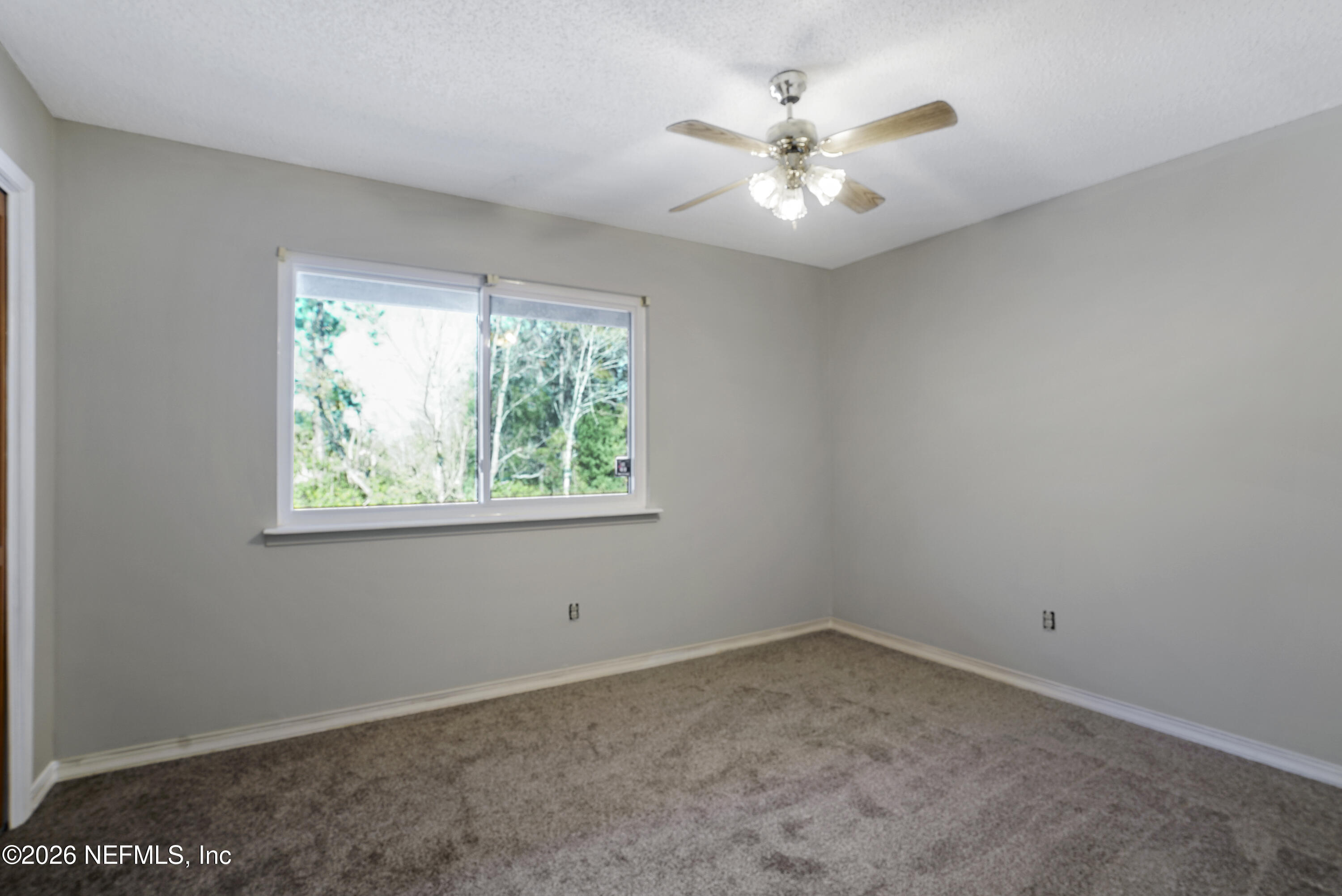 3517 Peeler Road, Unit 23 Jacksonville, FL 32277 - Photo 21 of 24 an empty room with a window