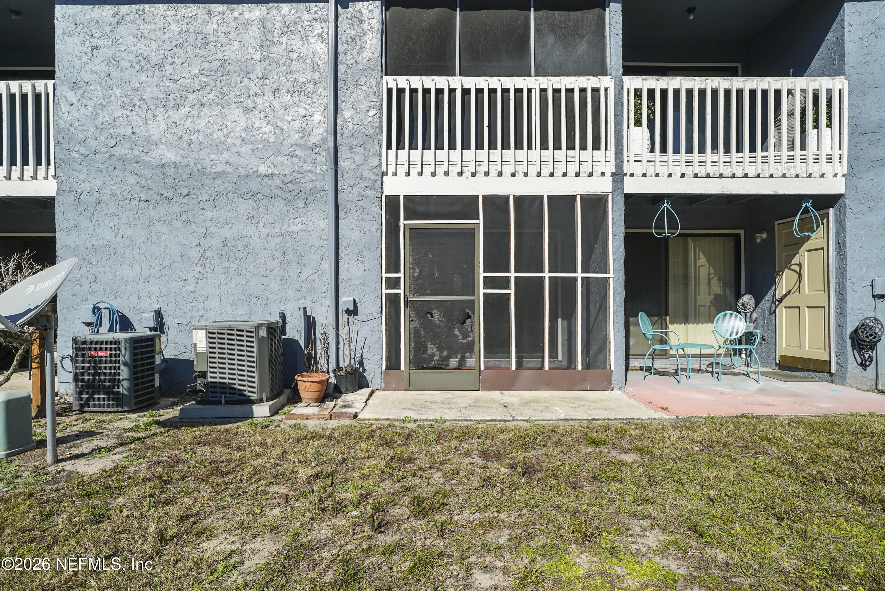3517 Peeler Road, Unit 23 Jacksonville, FL 32277 - Photo 23 of 24 a view of a house with a patio and wooden fence