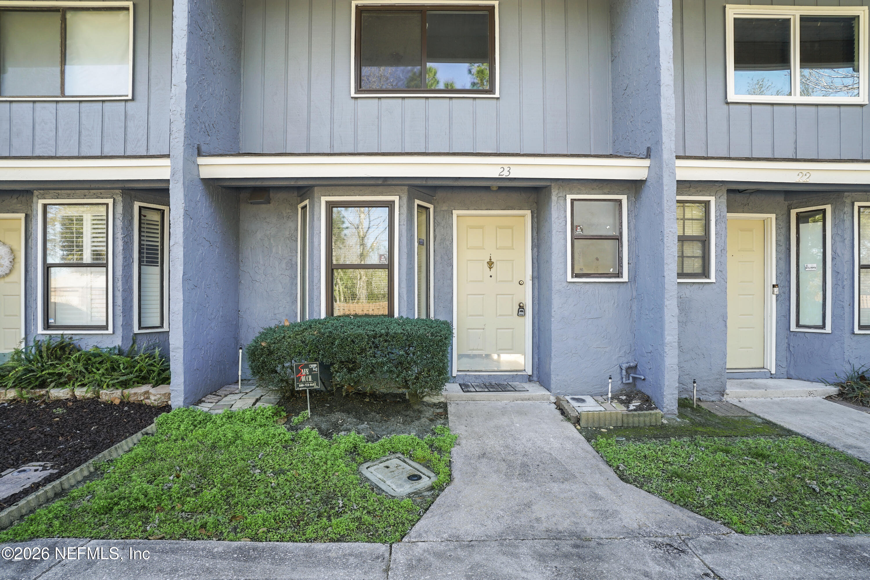 3517 Peeler Road, Unit 23 Jacksonville, FL 32277 - Photo 24 of 24 a front view of a house having yard