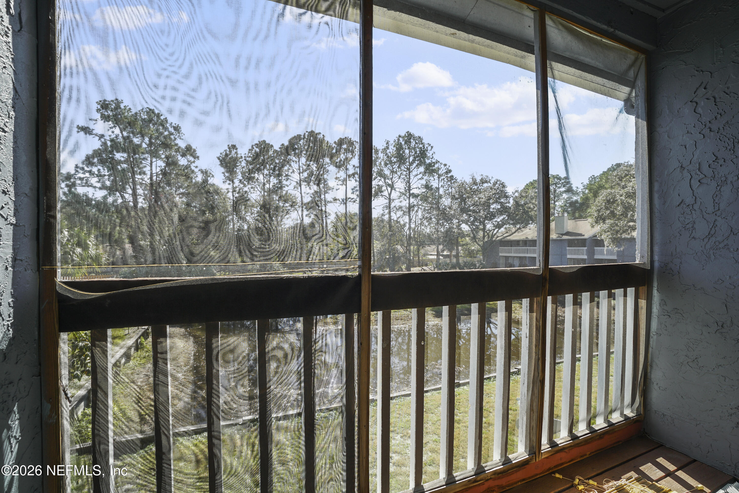 3517 Peeler Road, Unit 23 Jacksonville, FL 32277 - Photo 6 of 24 a view of a street from a window