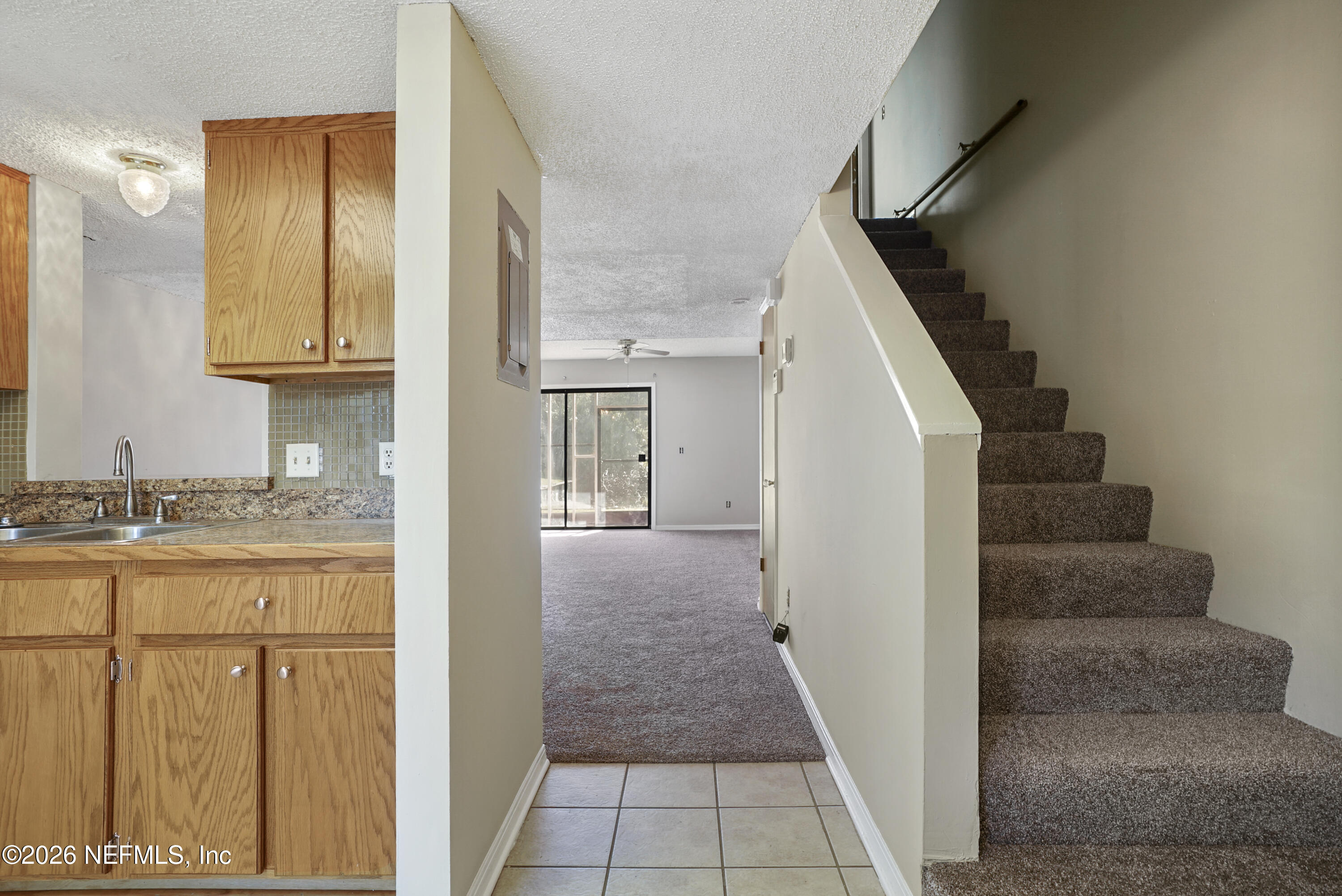 3517 Peeler Road, Unit 23 Jacksonville, FL 32277 - Photo 8 of 24 a view of a kitchen with granite countertop cabinets