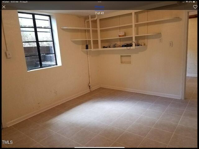 2346 Wade Avenue Raleigh, NC 27607 - Photo 12 of 20 a view of a room with racks on the wall and a window