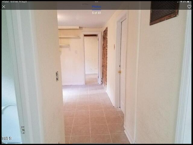 2346 Wade Avenue Raleigh, NC 27607 - Photo 14 of 20 a view of a hallway with wooden floor