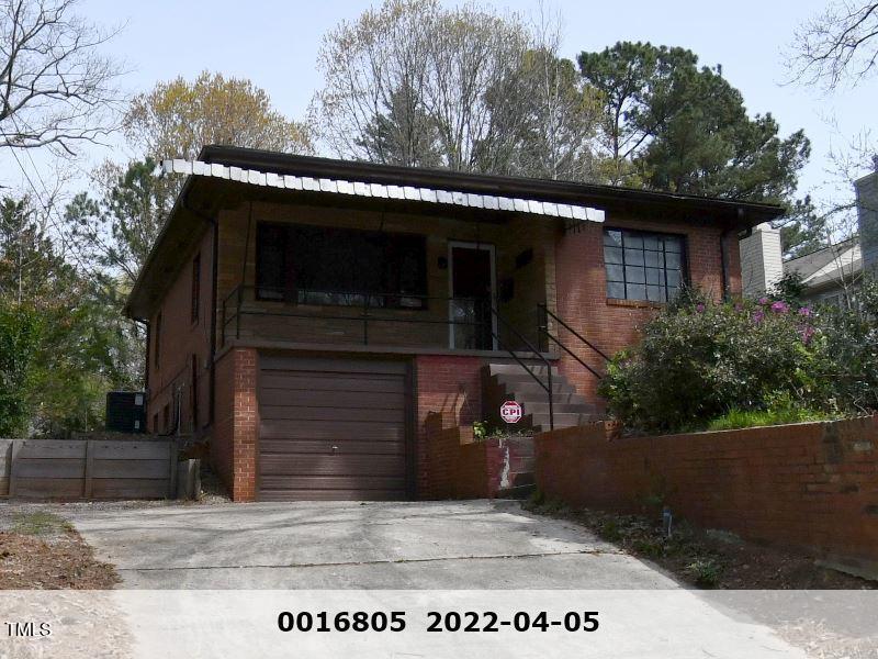 2346 Wade Avenue Raleigh, NC 27607 - Photo 2 of 20 a front view of a house with a garden