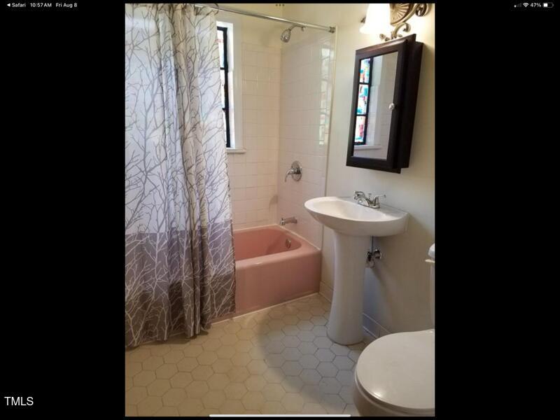 2346 Wade Avenue Raleigh, NC 27607 - Photo 5 of 20 a bathroom with a sink toilet and shower