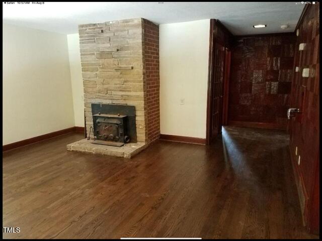 2346 Wade Avenue Raleigh, NC 27607 - Photo 6 of 20 a view of an empty room with wooden floor