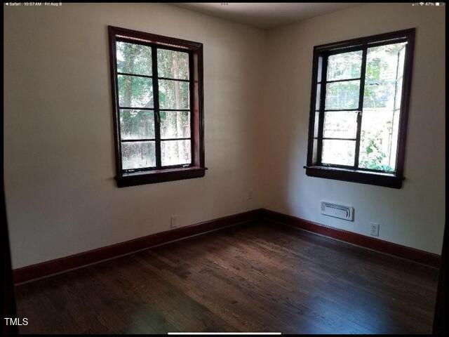 2346 Wade Avenue Raleigh, NC 27607 - Photo 8 of 20 an empty room with wooden floor and windows