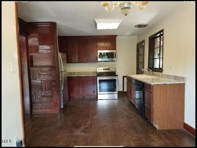 2346 Wade Avenue Raleigh, NC 27607 - Photo 9 of 20 a large kitchen with stainless steel appliances granite countertop a refrigerator and a sink