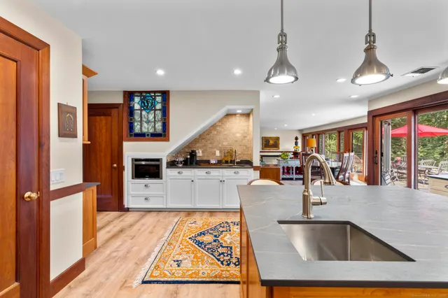 a bathroom with a double vanity sink toilet and a mirror