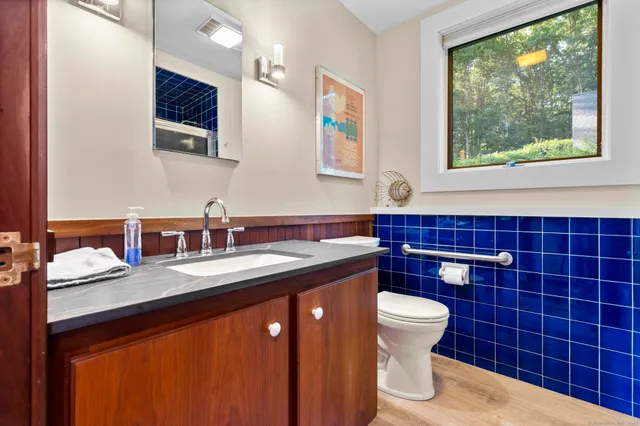 a bedroom with furniture and large windows